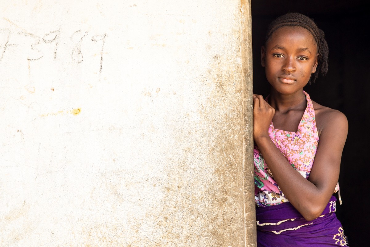 UNICEF conducts door-to-door campaigns to map active cases of Ebola in Tewor district, Liberia. To keep track of the homes visited, the team writes details on the walls of the houses.